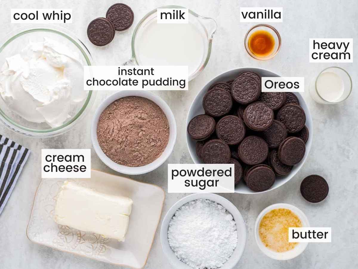 Chocolate Lasagna ingredients including Oreos, cream cheese, milk, cool whip, chocolate pudding mix, butter, and vanilla.