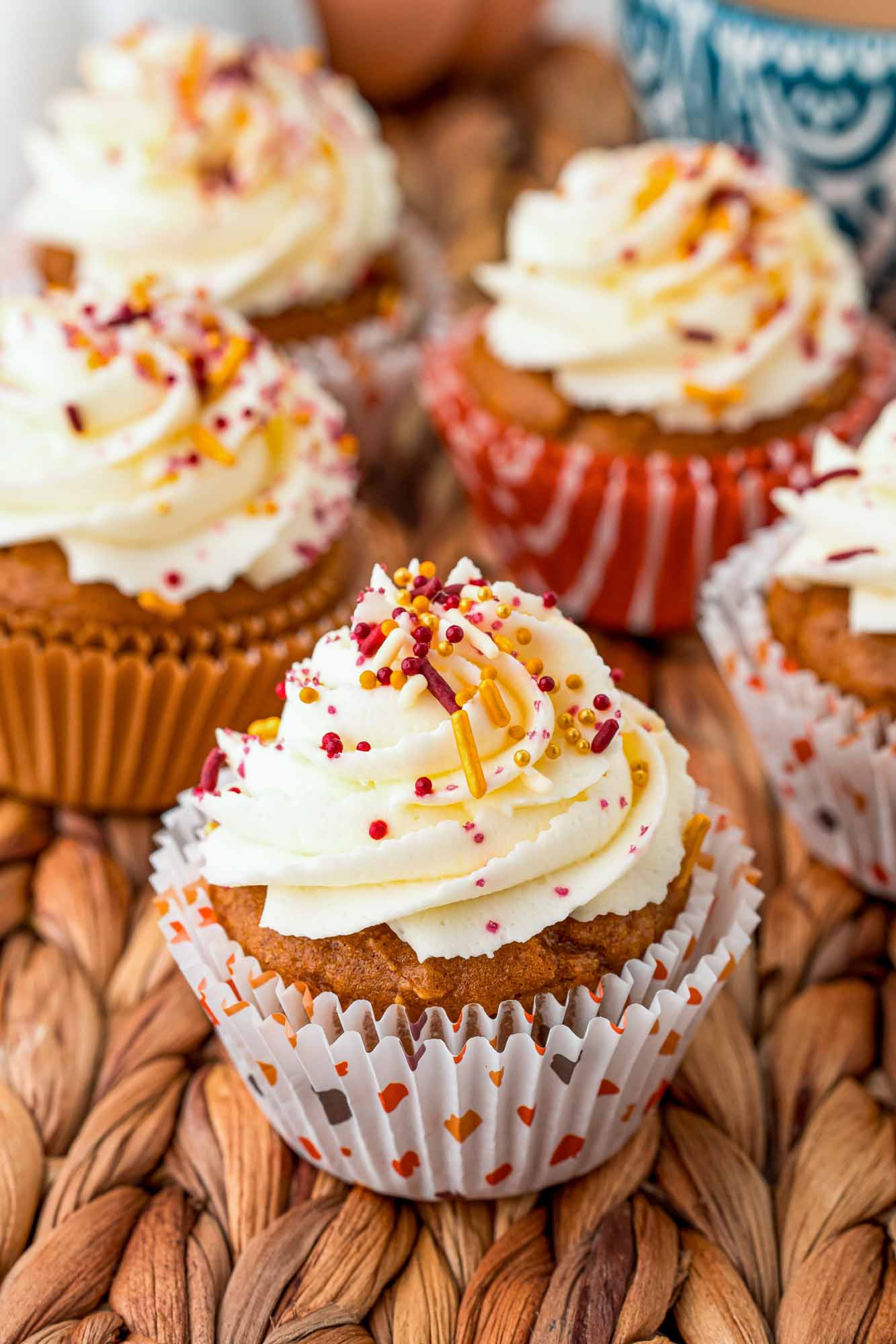 Pumpkin cupcakes with frosting and sprinkles