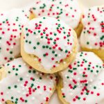 Ricotta cookies with holiday sprinkles on a white plate
