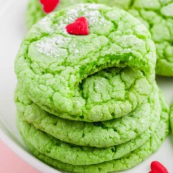 Stacked grinch cookied decorated with heart sprinkles.