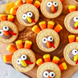Golden Oreos decorated to look like Turkeys with candy corn feathers