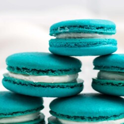 A pryamid stack of teal blue cream filled baby yoda macrons