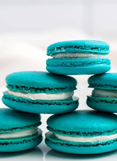 A pryamid stack of teal blue cream filled baby yoda macrons