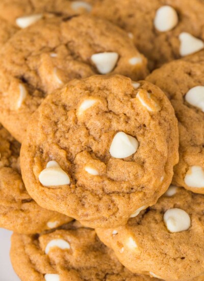 closeup view of a plate of pumpkin spice cookies with white chocolate chips