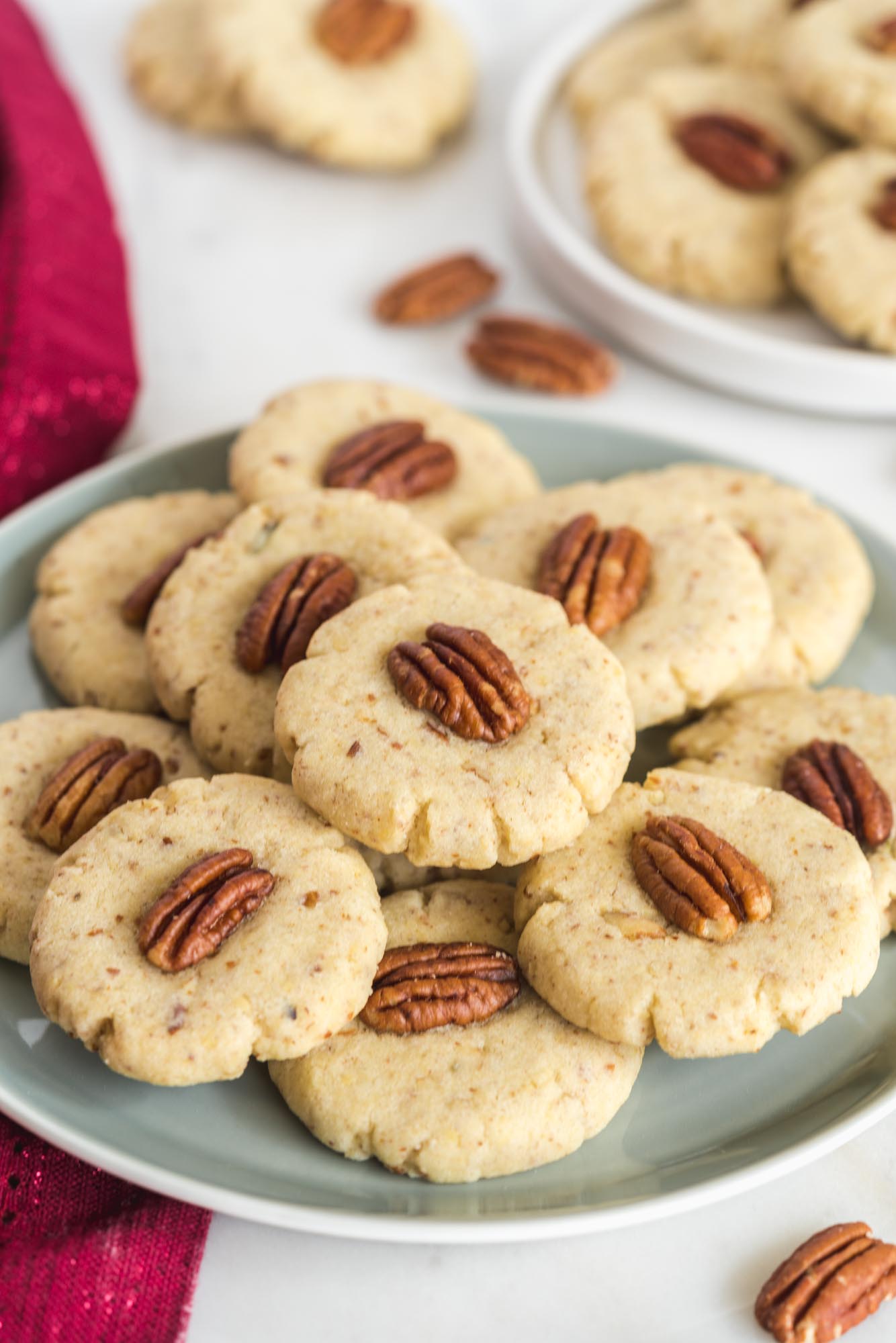 a muted green plate filled with pecan sandies.