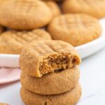 3 peanut butter cookie stacked, showing a bite shot