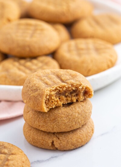 3 peanut butter cookie stacked, showing a bite shot