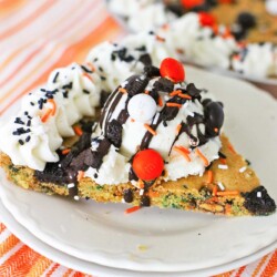 A slice of halloween cookie cake with ice cream plated
