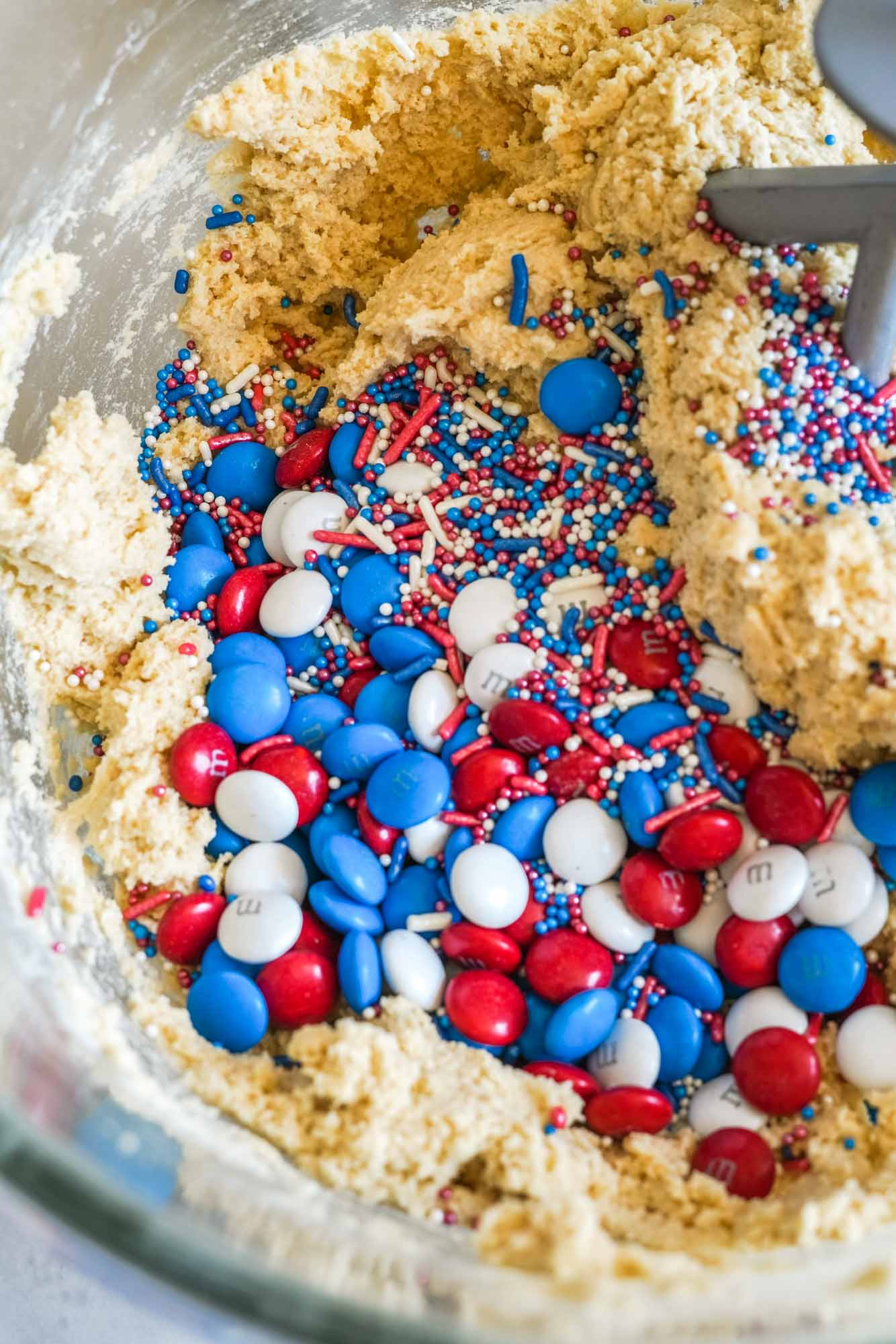 Cookie dough with patriotic M&M's and sprinkles