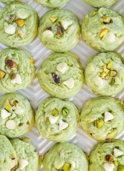 Overhead shot of pistachio cookies on a cookie sheet