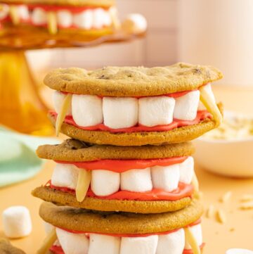 three chocolate chip cookie sandwiches with marshmallows and almonds to look like dracula's dentures