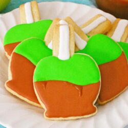 Caramel apple decorated sugar cookies on a white plate