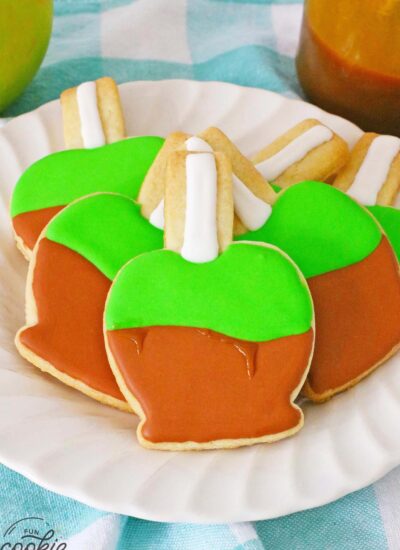 Caramel apple decorated sugar cookies on a white plate