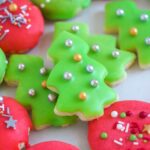 close up shot of christmas cookies with easy cookie icing and sprinkles