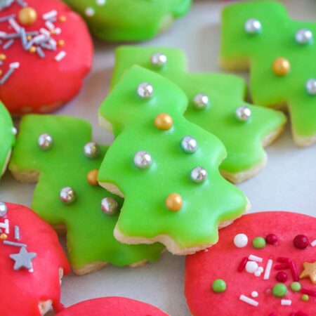close up shot of christmas cookies with easy cookie icing and sprinkles