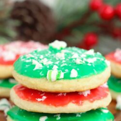 Three stacked meltaway cookies iced with green and red icing, and topped with crushed candy cane