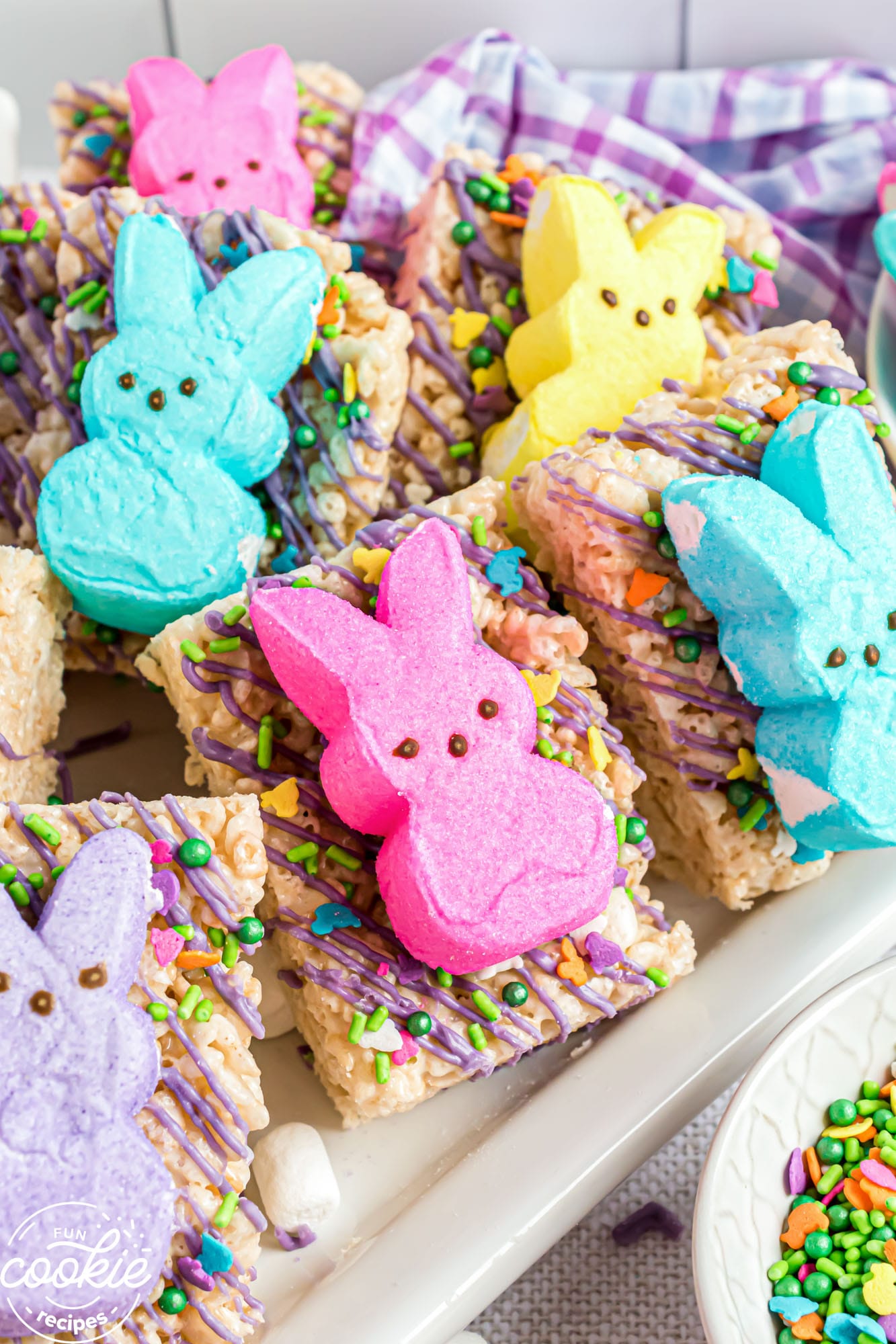 Easter themed rice krispie treats decorated with bunny peeps