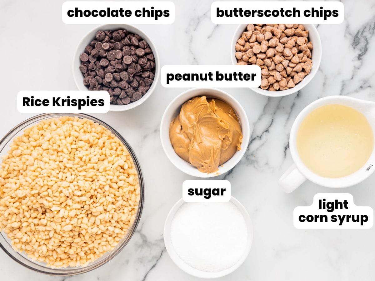 6 ingredients for scotcheroos, all measured into small bowls and arranged on a marble counter. Text boxes label each bowl: chocolate chips, butterscotch chips, rice krispies, peanut butter, sugar, light corn syrup