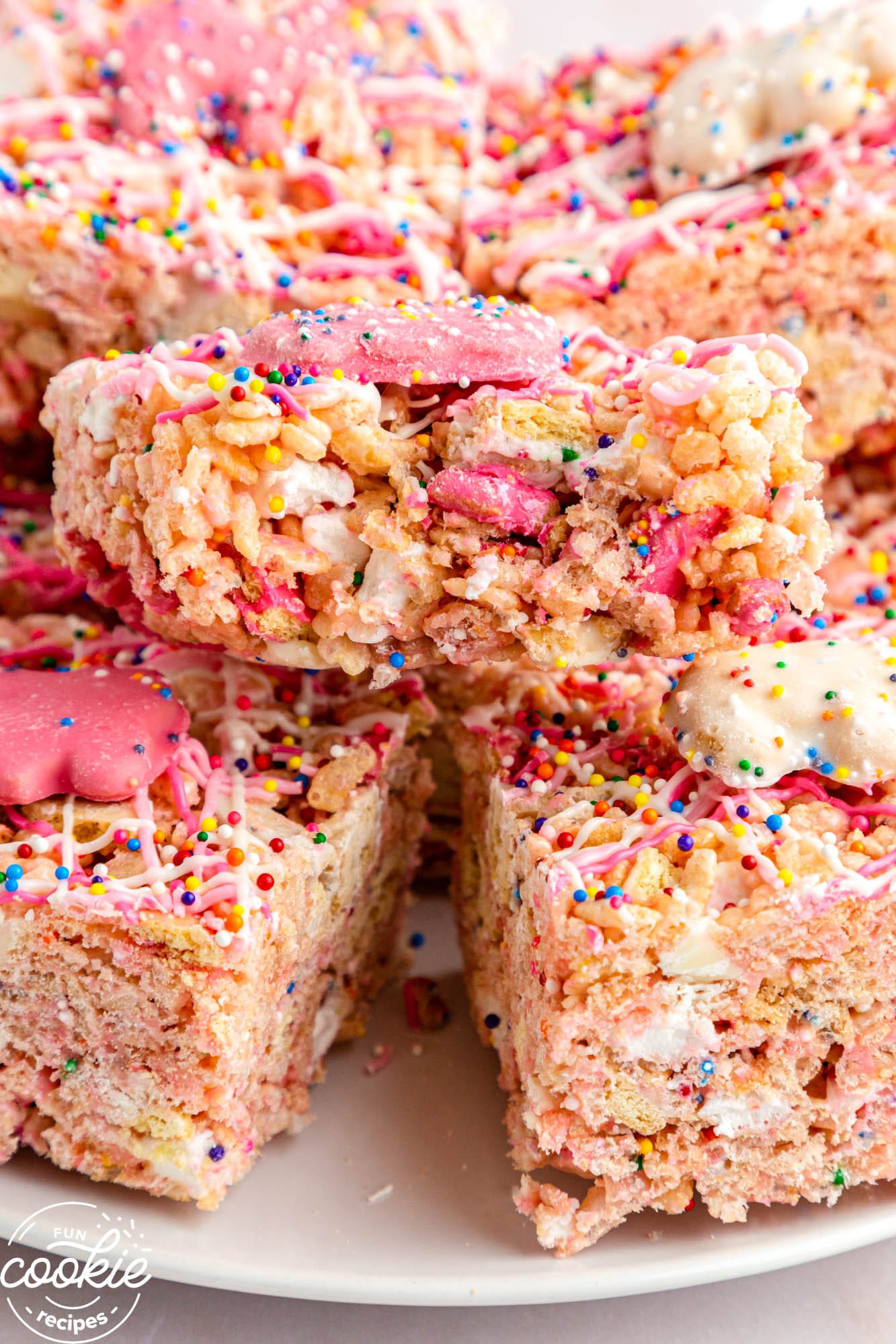 Circus Animal Cookies Rice Krispie Treats, showing a bite shot on a white plate