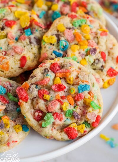 Colorful fruity pebbles cookies with chocolate chips on a white plate
