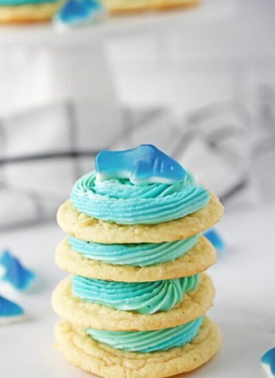 four shark cookie stacked on top of each other.