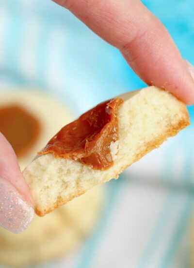 A bite shot of dulche de leche cookies to show the texture of the filling and the crumb