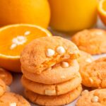 Showing a bite shot of orange creamsicle cookies