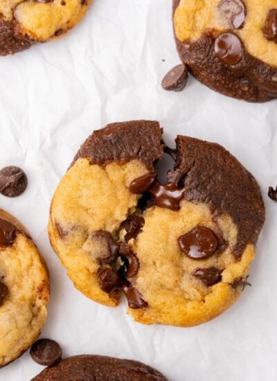 a half and half brookie, broken in haf to show melty chocolate chips.