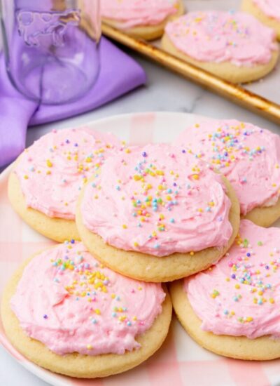a plate with 5 large lofthouse style sugar cookies on it.