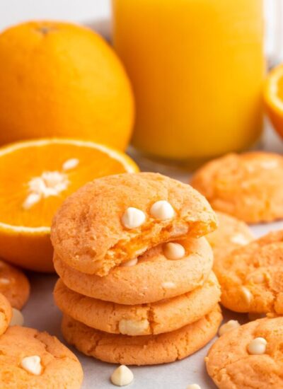 Showing a bite shot of orange creamsicle cookies