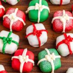 Overhead shot of Christmas Present Oreo Truffles on a wooden background