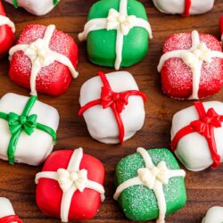Overhead shot of Christmas Present Oreo Truffles on a wooden background