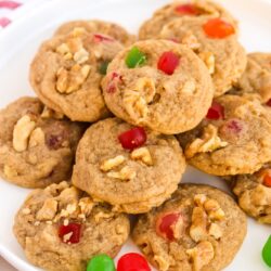 Gumdrop cookies with walnuts stacked on a white plate