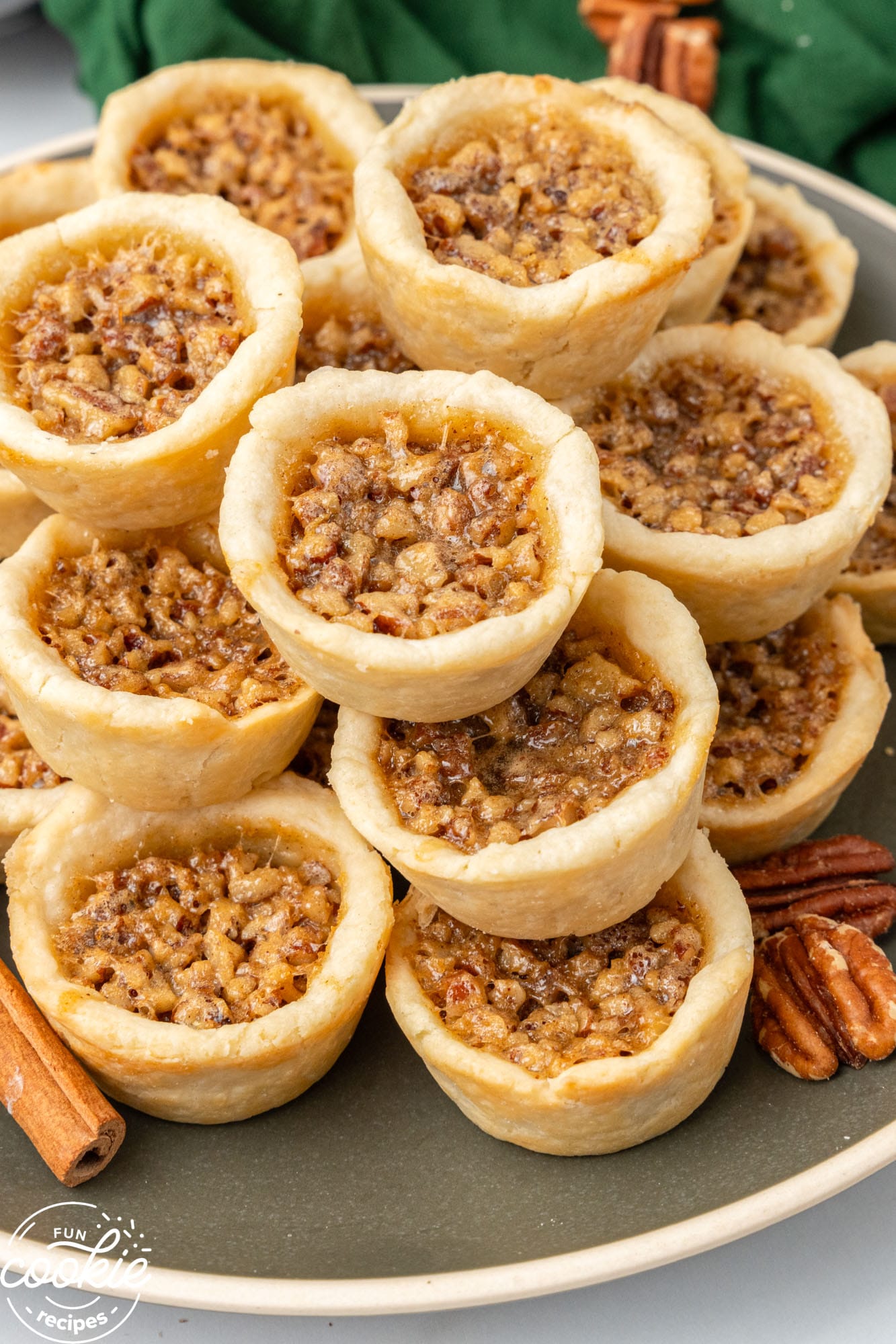 a plate piled with pecan tassies.