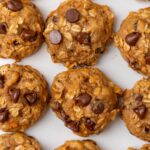 sweet potato cookies with chocolate chips and oats, lined up .